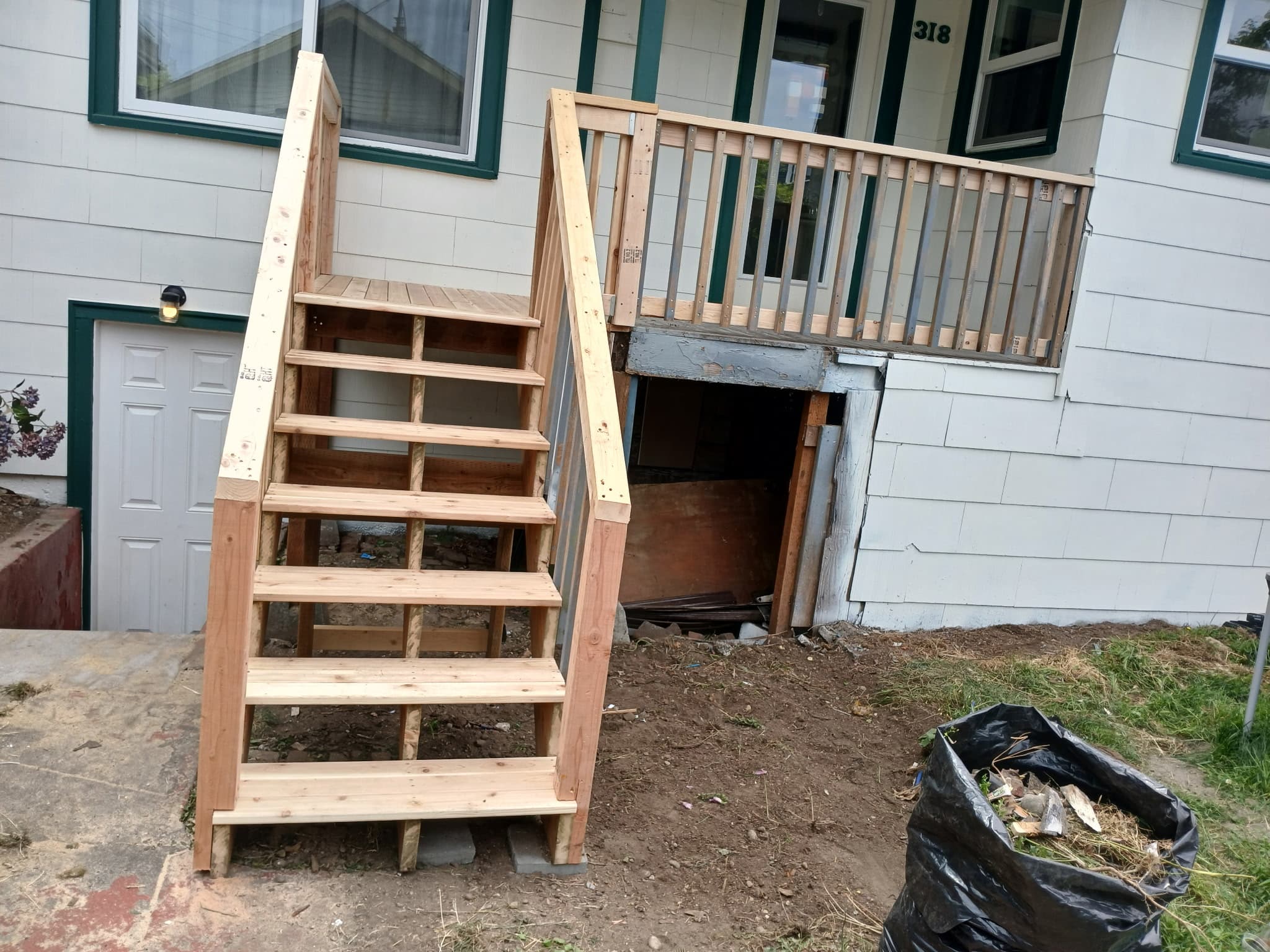 Renovated residential porch and entry after remodel completion