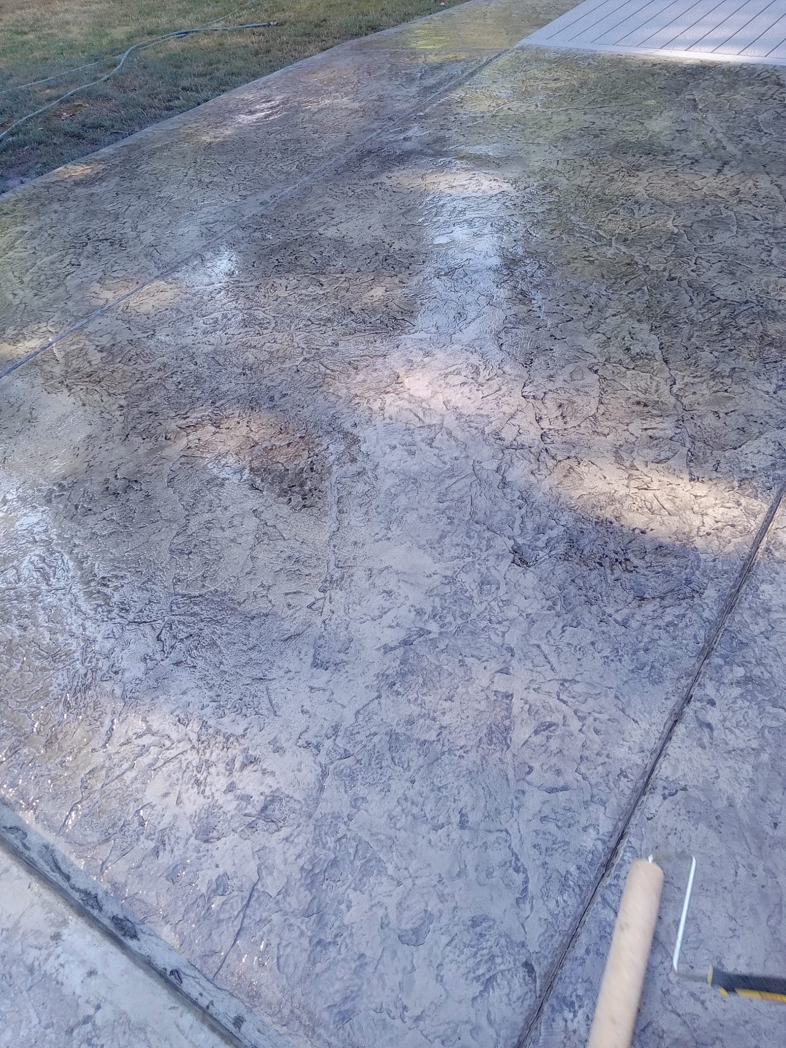 Close-up of stamped concrete with clean expansion joint line